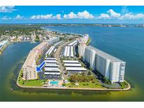 Aerial view of a waterfront community with parking and pool at 6075 Shore S Blvd # 501, Gulfport, FL 33707
