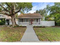 Charming bungalow with a front porch and landscaping at 55 W Lemon St, Tarpon Springs, FL 34689