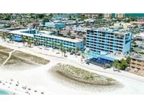 Aerial view of beachfront hotel with pool and beach access at 10650 Gulf Blvd # 340, Treasure Island, FL 33706