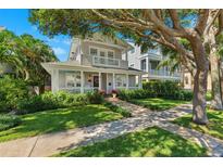 Charming two-story home with a welcoming front porch and beautiful landscaping at 106 19Th Ave, St Pete Beach, FL 33706