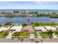 Aerial view of a waterfront property at 10434 Sovereign Dr, Largo, FL 33774