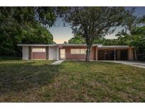 Mid-century ranch home with carport at 1618 Valencia St, Clearwater, FL 33756