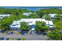 Aerial view of community, showcasing building and parking at 2599 Dolly Bay Dr # 308, Palm Harbor, FL 34684