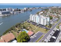 Aerial view of condo building near the water at 10216 Regal Dr # 708, Largo, FL 33774