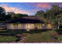 Single story home with a well-maintained lawn and palm trees at 6700 90Th N Ave, Pinellas Park, FL 33782