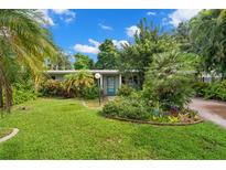 Charming house with a lush, landscaped front yard at 2517 Trinidad St, Sarasota, FL 34231