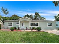 Newly renovated single-story home with a landscaped lawn and modern facade at 5530 & 5530 1/2 7Th N Ave, St Petersburg, FL 33710
