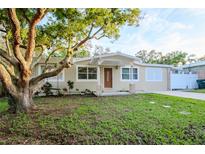Updated bungalow with a covered porch and mature landscaping at 219 6Th Sw Ave, Largo, FL 33770