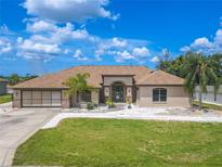 Single-story home with a large yard and attached garage at 10177 Sunburst Ct, Spring Hill, FL 34608