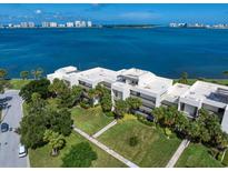 Condo building with water access and lush landscaping near the bay at 50 Coe Rd # 125, Belleair, FL 33756