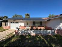 Charming single-story home with a well-maintained front yard and solar panels at 6312 Fairway Blvd, Apollo Beach, FL 33572