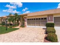 Brick home with two-car garage and landscaping at 6538 Pine Walk Dr, New Port Richey, FL 34655