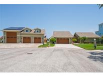 Two-car garage with solar panels at 3154 Brigantine Ct, New Port Richey, FL 34652