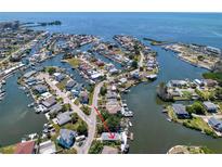 Waterfront home featuring canal access, beautiful landscaping, and a prime location in a desirable neighborhood at 6629 Harbor Dr, Hudson, FL 34667