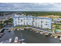 Aerial view of waterfront building and marina at 4939 Floramar Ter # 610, New Port Richey, FL 34652