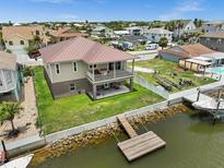 Two-story home with private dock and canal access at 7332 Islander Ln, Hudson, FL 34667