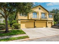 Two-story townhome with a double garage at 27563 Pleasure Ride Loop, Wesley Chapel, FL 33544