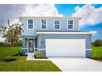 Two-story house with light blue vinyl siding, white trim, and a two-car garage at 8731 Starry Night Ter, Parrish, FL 34219