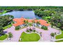 Luxury home with circular driveway and lakefront location at 4571 Lake In The Woods Dr, Spring Hill, FL 34607
