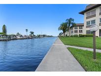 Scenic waterfront view showcasing the canal and well-maintained building exterior at 4632 Marine Pkwy # 302, New Port Richey, FL 34652