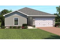 One-story home with attached garage, brick facade, and landscaping at 14300 Whitewater Way, Brooksville, FL 34604