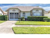 One-story house with a two-car garage and neatly landscaped yard at 4750 Carrington Ct, New Port Richey, FL 34655