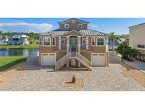 Two story waterfront home with attached two car garage at 3448 Triggerfish Dr, Hernando Beach, FL 34607
