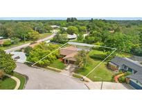 Aerial view of a home nestled in a green neighborhood at 7504 Cypress Knee Dr, Hudson, FL 34667