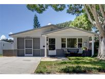 Charming single story home with gray accents and a covered porch at 6642 Stewart N Ave, St Petersburg, FL 33702