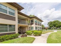 Two-story building exterior with landscaping at 5142 Topaz Ln # 202, New Port Richey, FL 34652