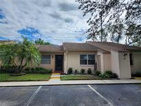 Tan colored exterior of a house with green landscaping at 3728 Sailmaker Ln # 1702, Holiday, FL 34691