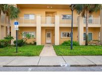 Two-story building with multiple entrances and parking at 2209 Utopian E Dr # 109, Clearwater, FL 33763