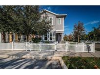 Charming two-story home featuring a white picket fence and well-maintained landscaping at 10595 Marsha Dr, New Port Richey, FL 34655