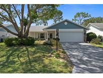 Charming single story home with attached garage and landscaping at 6387 Plantation Rd, Spring Hill, FL 34606