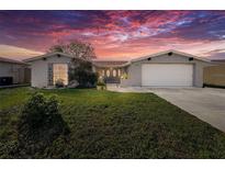 Charming single-Gathering home with well-manicured lawn at 7310 Rockwood Dr, Port Richey, FL 34668