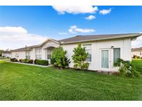 Charming single-story home with well-maintained lawn and garden in a quiet neighborhood setting at 1931 Sassafras Dr, Wesley Chapel, FL 33543