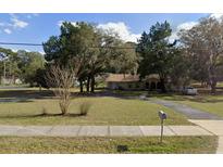 Ranch style home with large yard and driveway at 33288 Ridge Manor Blvd, Dade City, FL 33523