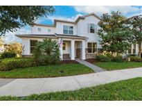 Two-story home with stone accents and a landscaped yard at 13022 Payton St, Odessa, FL 33556