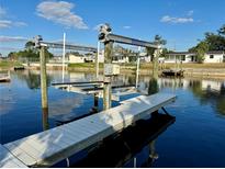 Private boat lift with dock access at 1354 Linstock Dr, Holiday, FL 34690