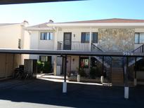 Condo building with carport and stairs leading to entrance at 9980 Eagles Point Cir # 3, Port Richey, FL 34668