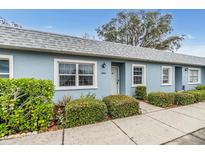 Inviting light blue exterior condo with well-manicured landscaping at 3644 Trophy Blvd, New Port Richey, FL 34655