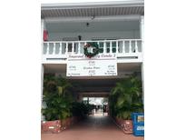 Condo building exterior, featuring a classic design and landscaping at 4746 Azalea Dr # 209, New Port Richey, FL 34652