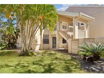 Inviting condo exterior with lush landscaping and a private entrance showcasing a serene and welcoming atmosphere at 121 Lindsay Ln # 31, Oldsmar, FL 34677