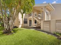Charming condo with a well-kept lawn and inviting front entrance at 121 Lindsay Ln # 31, Oldsmar, FL 34677