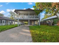 Elevated home with a spacious deck and large backyard at 1244 31St E Ave, Bradenton, FL 34208
