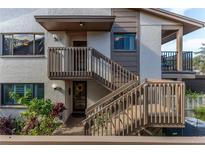 Condo building exterior with stairs and landscaping at 12814 Wedgewood Way # C, Hudson, FL 34667