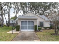 Charming single-story home with a screened garage and well-maintained landscaping at 4846 Leyte Ct, New Port Richey, FL 34655