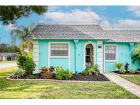 Quaint teal home with well-manicured landscaping at 4209 Prince Pl # A, New Port Richey, FL 34652