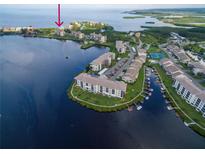Aerial view of waterfront condo community with pool and boat slips at 4550 Bay Blvd # 1237, Port Richey, FL 34668