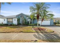 Charming one-story home with a two-car garage and landscaped yard at 8540 Caitlin Ct, Hudson, FL 34667